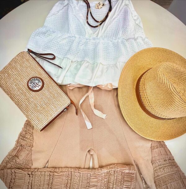 White and tan shirts, tan purse and straw hat